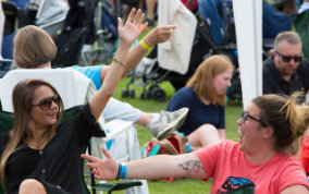 Lingfest 2019 Ladies sitting and waving in the crowd ©Brett Butler